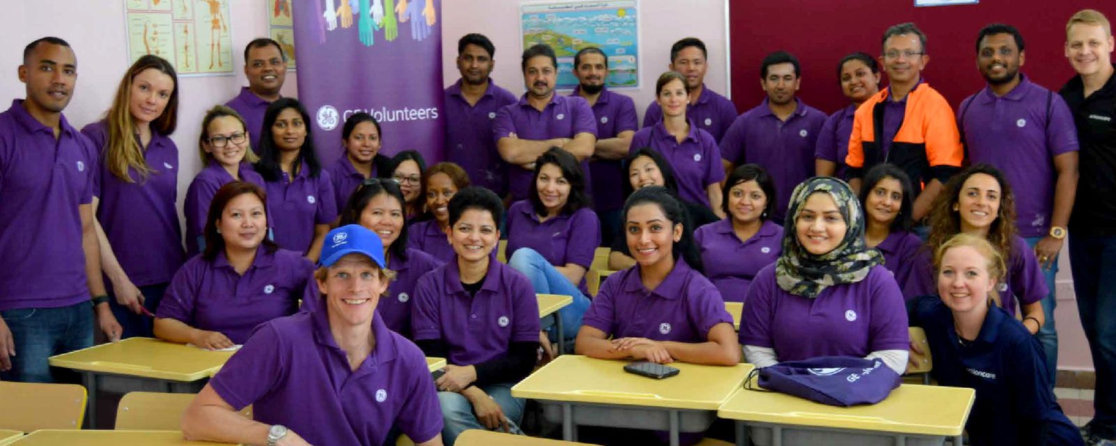 Transforming Learning Spaces — volunteers in a renovated classroom